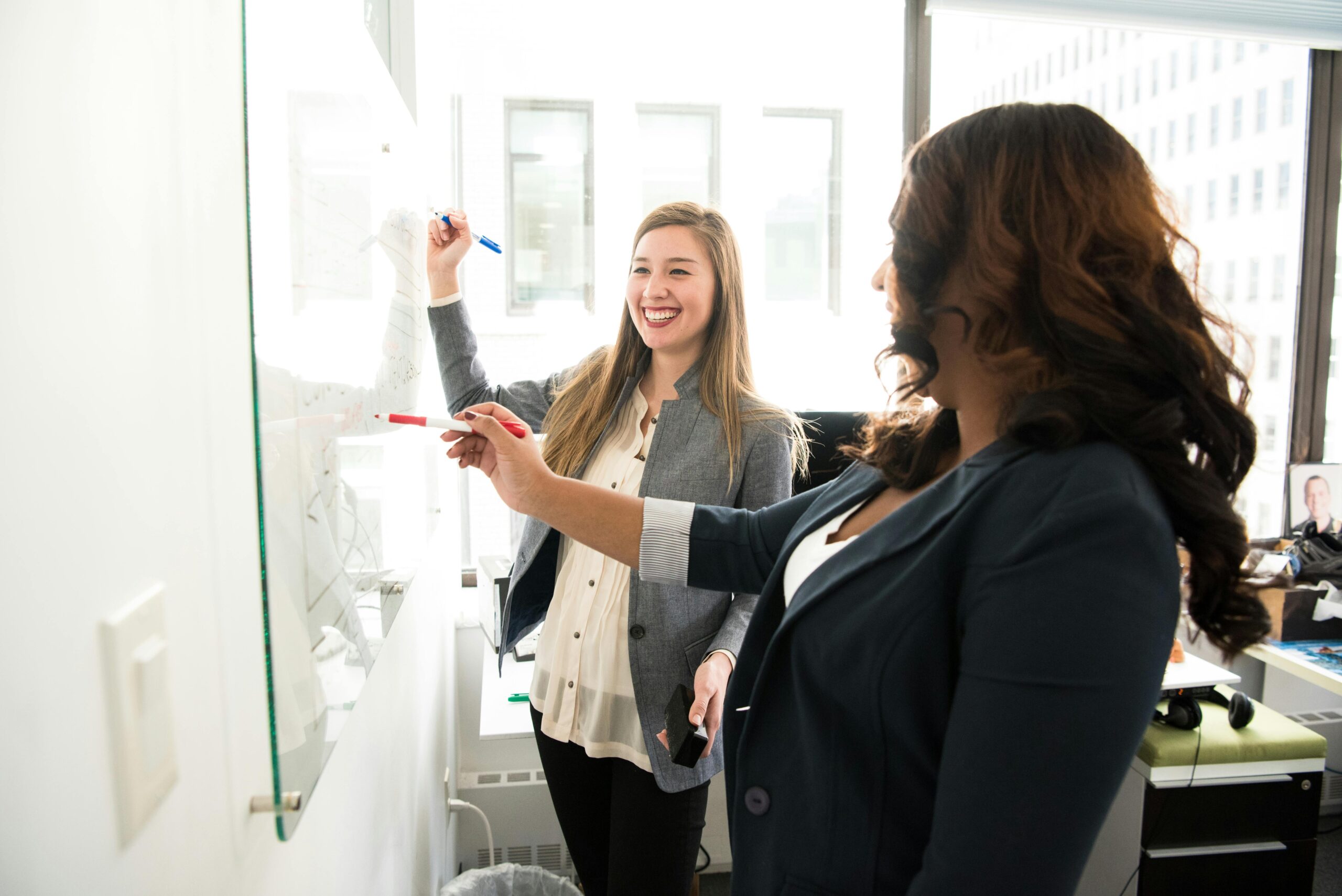 professionals working on a whiteboard